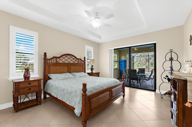 10029 Boylston St, Port Charlotte, FL 33981 - bedroom featuring a tray ceiling, access to exterior, ceiling fan, and light tile patterned flooring
