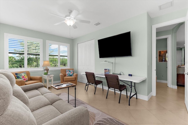 10029 Boylston St, Port Charlotte, FL 33981 - living room featuring light tile patterned floors, a ceiling fan, and an office area