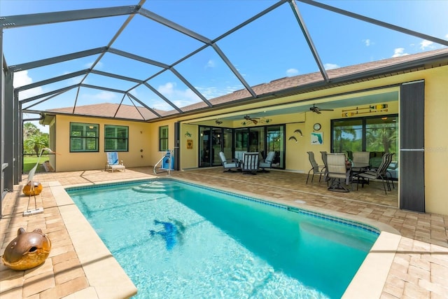 10029 Boylston St, Port Charlotte, FL 33981 - outdoor pool with a ceiling fan, a patio area, and glass enclosure