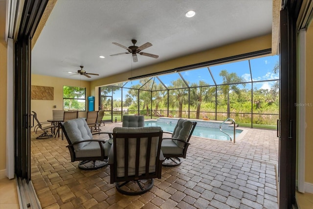 10029 Boylston St, Port Charlotte, FL 33981 - view of patio / terrace with an outdoor pool, ceiling fan, a lanai, and outdoor dining space