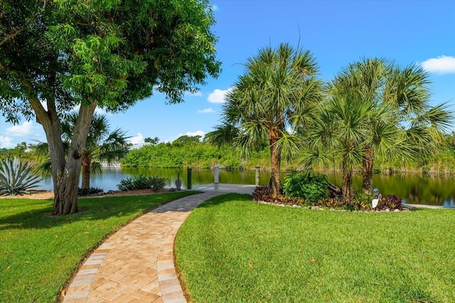10029 Boylston St, Port Charlotte, FL 33981 - surrounding community with a water view and a lawn