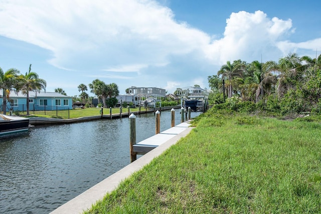 10452 Raymond St, Englewood, FL 34224 - dock featuring a water view, a residential view, and a yard