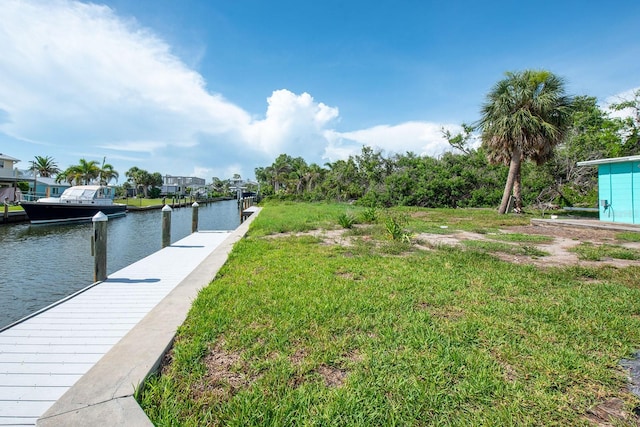 10452 Raymond St, Englewood, FL 34224 - dock with a water view and a lawn
