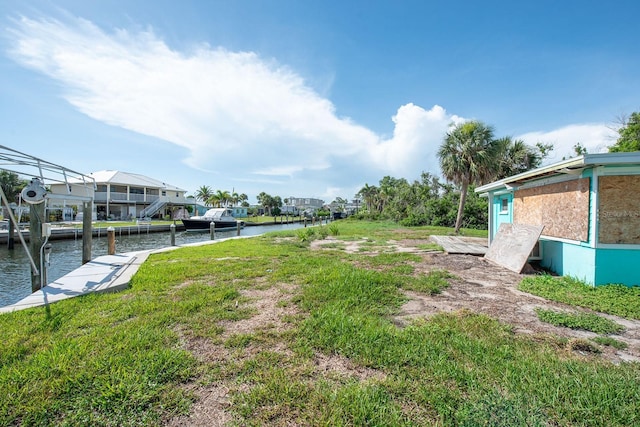 10452 Raymond St, Englewood, FL 34224 - view of grassy yard featuring a water view