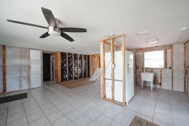 10452 Raymond St, Englewood, FL 34224 - interior space with a ceiling fan, tile patterned floors, and a textured ceiling