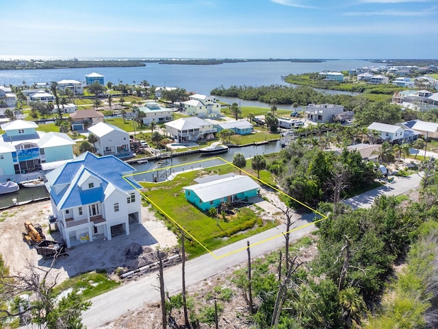 10452 Raymond St, Englewood, FL 34224 - aerial perspective of suburban area with a nearby body of water and property parcel outlined