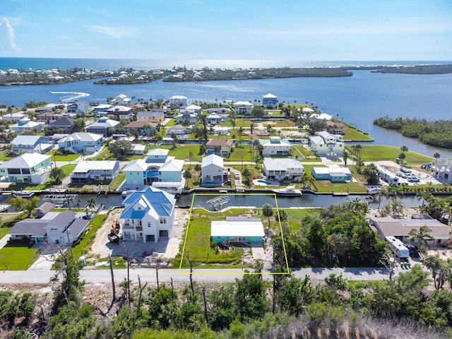 10452 Raymond St, Englewood, FL 34224 - aerial perspective of suburban area featuring property boundaries highlighted and a large body of water
