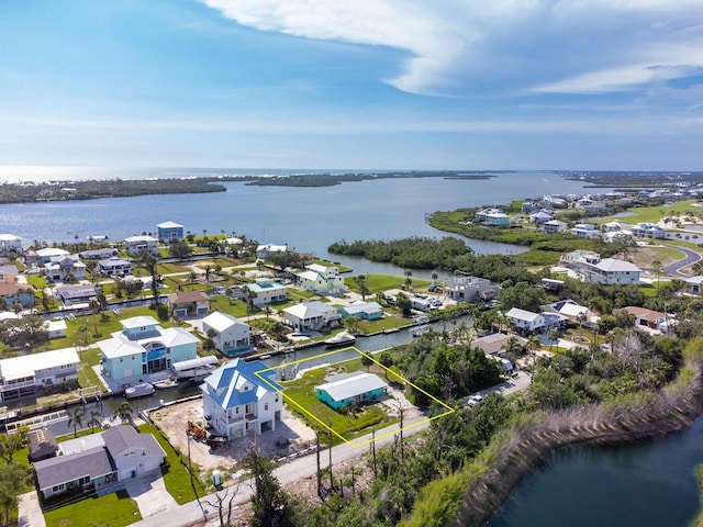 10452 Raymond St, Englewood, FL 34224 - aerial view of residential area featuring a large body of water and property parcel outlined