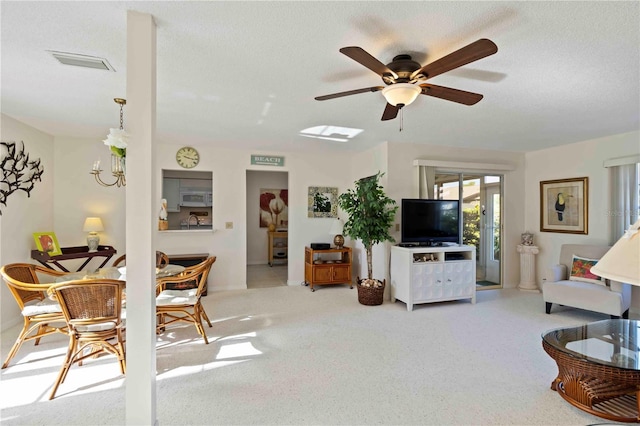 609 Deerwood Ave, Englewood, FL 34223 - living area with a ceiling fan, carpet floors, and a textured ceiling