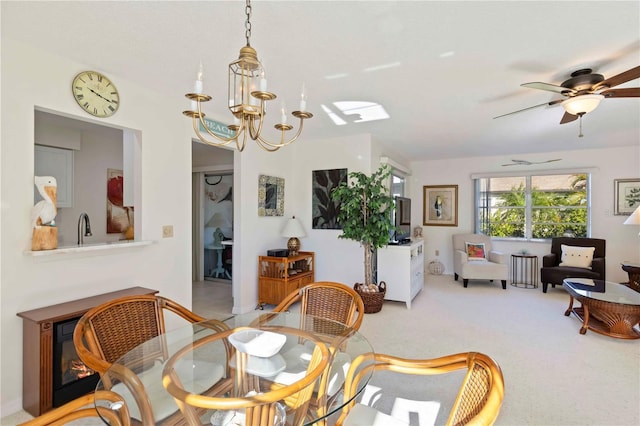 609 Deerwood Ave, Englewood, FL 34223 - dining room featuring a chandelier, ceiling fan, and carpet