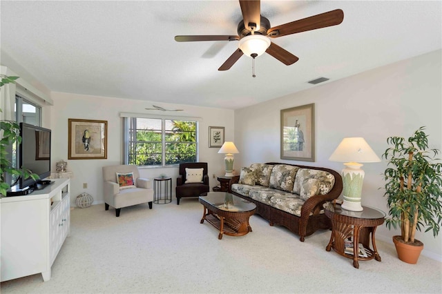 609 Deerwood Ave, Englewood, FL 34223 - living room with healthy amount of natural light, light carpet, and a ceiling fan