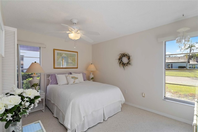609 Deerwood Ave, Englewood, FL 34223 - bedroom with a ceiling fan and a chandelier