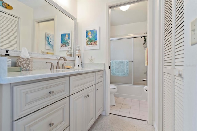 609 Deerwood Ave, Englewood, FL 34223 - full bathroom featuring a closet, vanity, and shower / bath combination with glass door