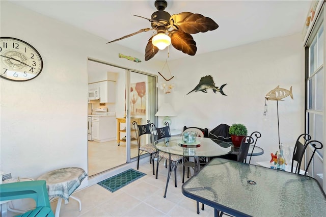 609 Deerwood Ave, Englewood, FL 34223 - dining room with a ceiling fan and light tile patterned flooring