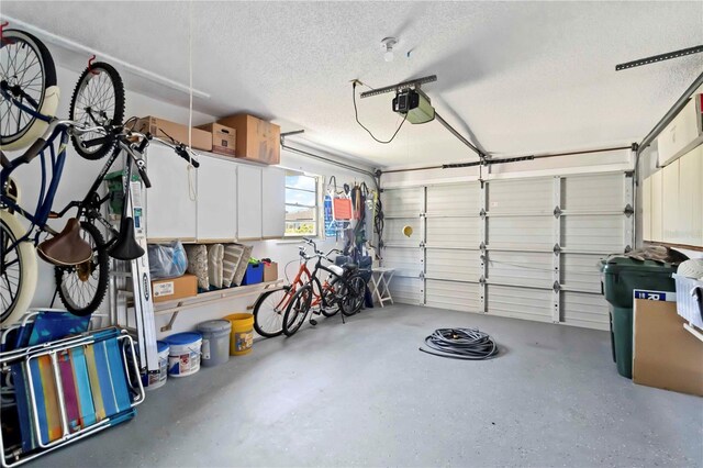 609 Deerwood Ave, Englewood, FL 34223 - garage featuring a garage door opener