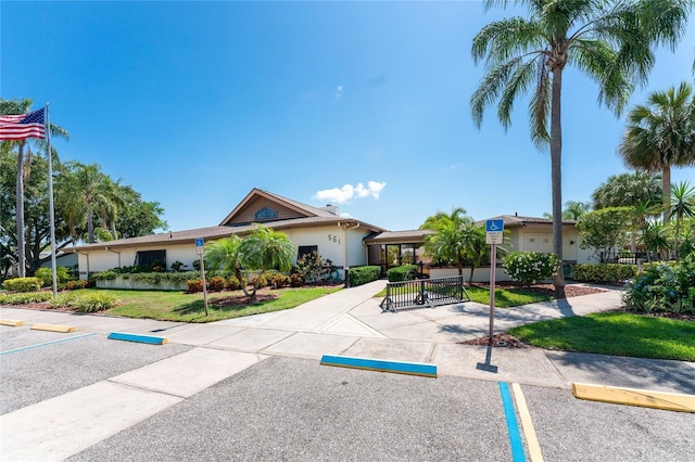 609 Deerwood Ave, Englewood, FL 34223 - view of building exterior featuring uncovered parking