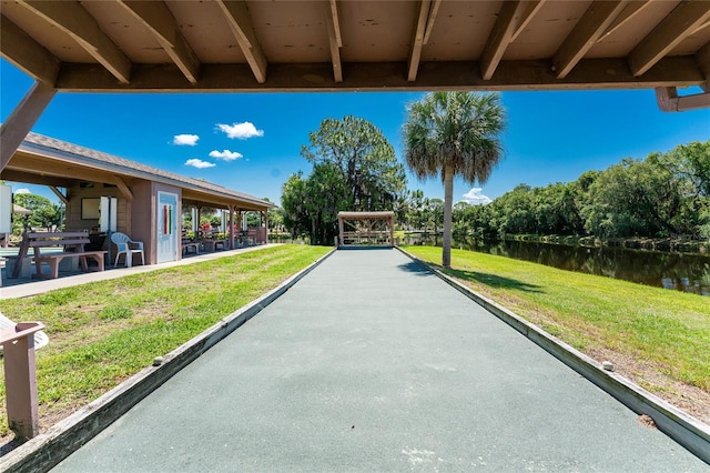 609 Deerwood Ave, Englewood, FL 34223 - view of patio featuring a bocce ball area and a water view