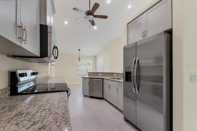 5781 Elton Rd, Venice, FL 34293 - kitchen with appliances with stainless steel finishes, a peninsula, ceiling fan, light stone countertops, and recessed lighting