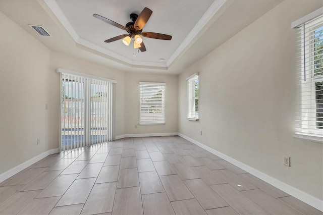 5781 Elton Rd, Venice, FL 34293 - spare room with a tray ceiling, plenty of natural light, ceiling fan, and crown molding