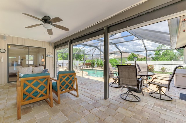 7218 Darlington St, Englewood, FL 34224 - view of patio / terrace featuring a ceiling fan, an outdoor hangout area, glass enclosure, and outdoor dining space