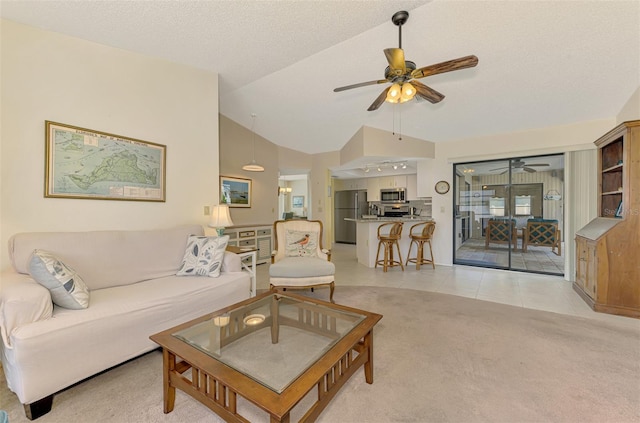 7218 Darlington St, Englewood, FL 34224 - living area with a ceiling fan, lofted ceiling, light carpet, and light tile patterned flooring