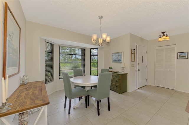 7218 Darlington St, Englewood, FL 34224 - dining room featuring a chandelier, light tile patterned flooring, and a textured ceiling
