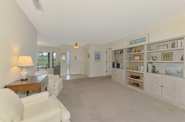7218 Darlington St, Englewood, FL 34224 - living room with light colored carpet and a textured ceiling