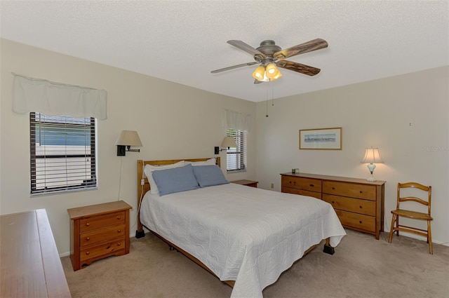 7218 Darlington St, Englewood, FL 34224 - bedroom with light colored carpet, a ceiling fan, and a textured ceiling