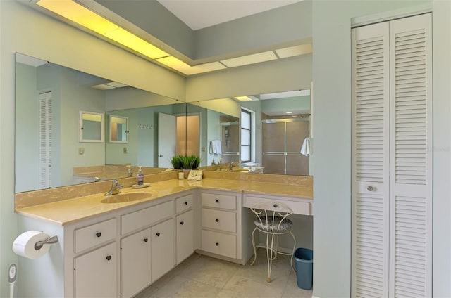 7218 Darlington St, Englewood, FL 34224 - full bathroom with a closet, a stall shower, tile patterned floors, and vanity