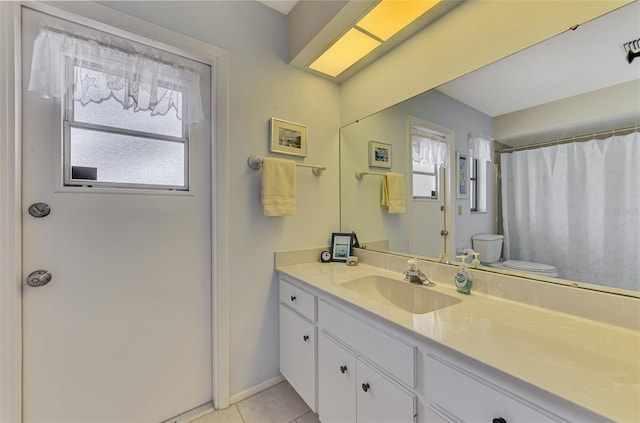 7218 Darlington St, Englewood, FL 34224 - bathroom with healthy amount of natural light, vanity, tile patterned flooring, and curtained shower