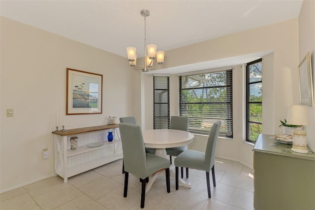 7218 Darlington St, Englewood, FL 34224 - dining room with a chandelier and light tile patterned floors