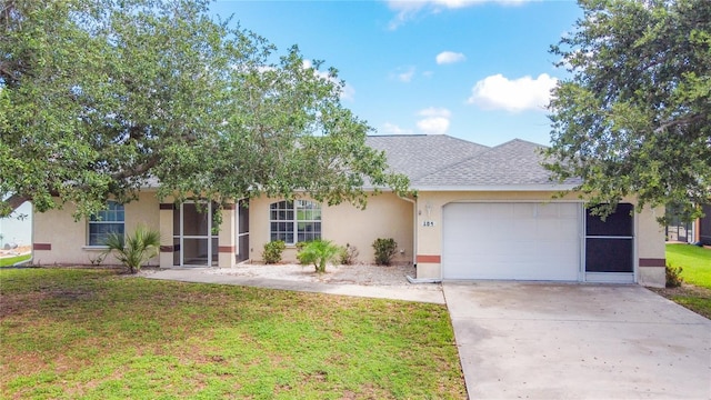 104 Mark Twain Ln, Rotonda West, FL 33947 - view of front of house with a garage, stucco siding, concrete driveway, a front lawn, and roof with shingles