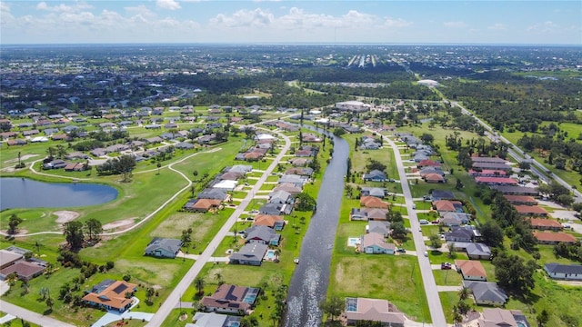 104 Mark Twain Ln, Rotonda West, FL 33947 - aerial view of property and surrounding area featuring nearby suburban area and a nearby body of water