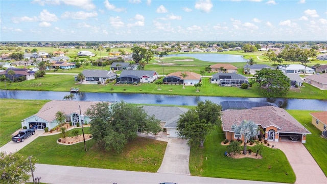 104 Mark Twain Ln, Rotonda West, FL 33947 - aerial perspective of suburban area with a large body of water