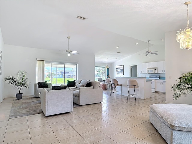 104 Mark Twain Ln, Rotonda West, FL 33947 - living room with ceiling fan, light tile patterned flooring, a chandelier, recessed lighting, and high vaulted ceiling