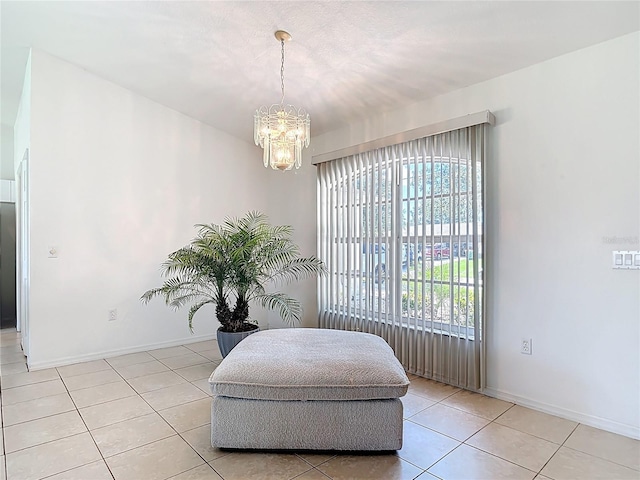 104 Mark Twain Ln, Rotonda West, FL 33947 - living area featuring light tile patterned floors and a chandelier