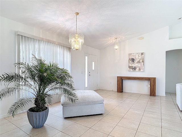 104 Mark Twain Ln, Rotonda West, FL 33947 - living room featuring a chandelier and light tile patterned floors