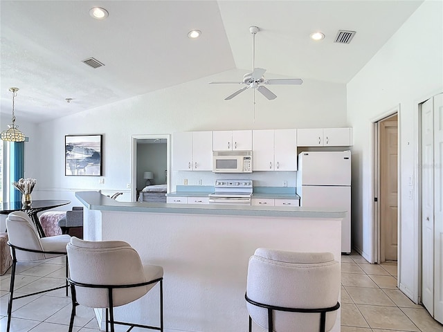 104 Mark Twain Ln, Rotonda West, FL 33947 - kitchen with white appliances, white cabinetry, light tile patterned flooring, light countertops, and recessed lighting