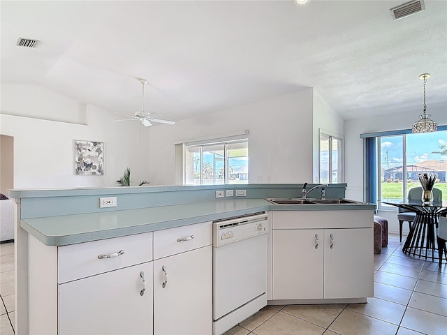 104 Mark Twain Ln, Rotonda West, FL 33947 - kitchen with dishwasher, vaulted ceiling, healthy amount of natural light, a ceiling fan, and light tile patterned floors