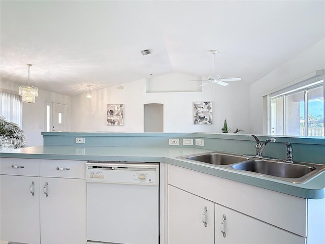 104 Mark Twain Ln, Rotonda West, FL 33947 - kitchen with white dishwasher, vaulted ceiling, white cabinets, light countertops, and ceiling fan