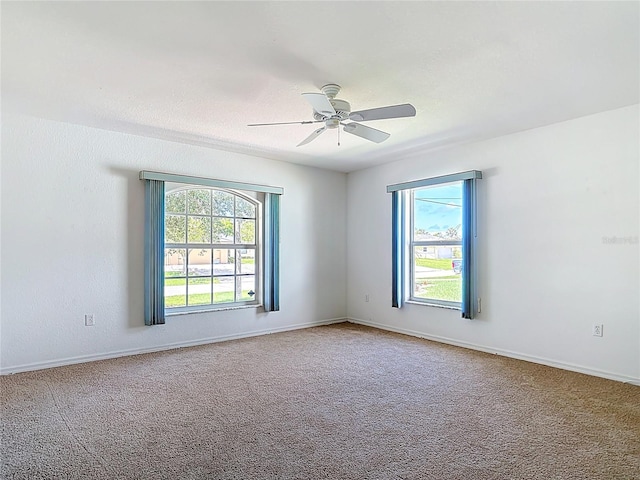 104 Mark Twain Ln, Rotonda West, FL 33947 - spare room featuring plenty of natural light, ceiling fan, and carpet