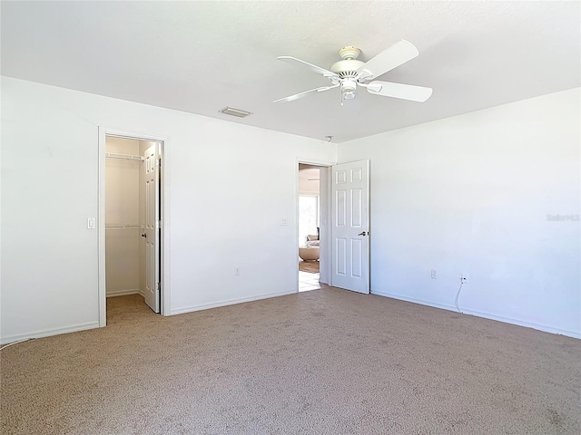 104 Mark Twain Ln, Rotonda West, FL 33947 - spare room with a ceiling fan and light carpet