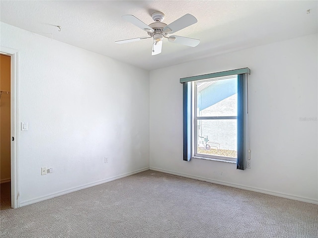 104 Mark Twain Ln, Rotonda West, FL 33947 - unfurnished room featuring light carpet and a ceiling fan