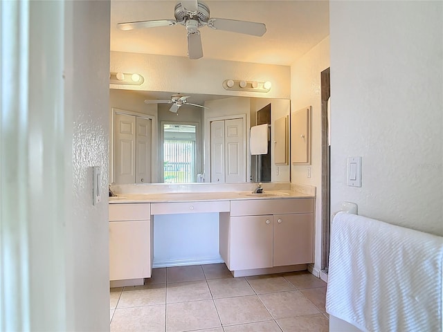 104 Mark Twain Ln, Rotonda West, FL 33947 - full bathroom with a textured wall, double vanity, tile patterned floors, and ceiling fan