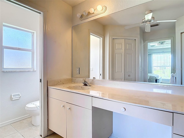 104 Mark Twain Ln, Rotonda West, FL 33947 - ensuite bathroom featuring vanity, a ceiling fan, and tile patterned flooring