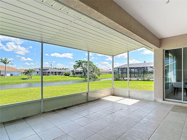 104 Mark Twain Ln, Rotonda West, FL 33947 - unfurnished sunroom featuring a residential view and a water view