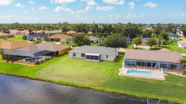 104 Mark Twain Ln, Rotonda West, FL 33947 - aerial perspective of suburban area with a pool area and a large body of water