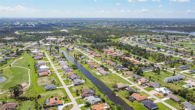 104 Mark Twain Ln, Rotonda West, FL 33947 - aerial overview of property's location featuring nearby suburban area and a nearby body of water