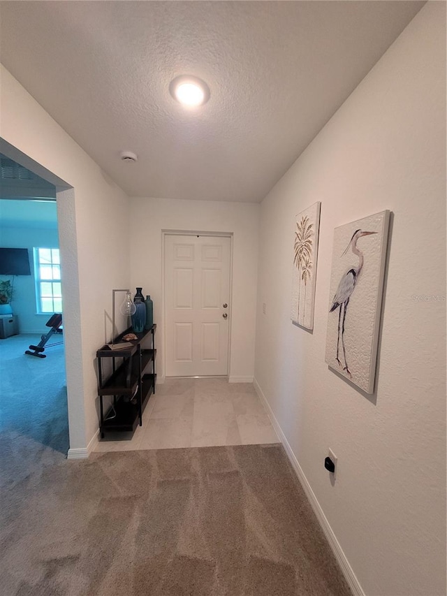 7168 Rison St, Port Charlotte, FL 33981 - hall featuring carpet and a textured ceiling