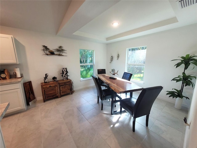 7168 Rison St, Port Charlotte, FL 33981 - dining space featuring plenty of natural light, a raised ceiling, and light tile patterned flooring